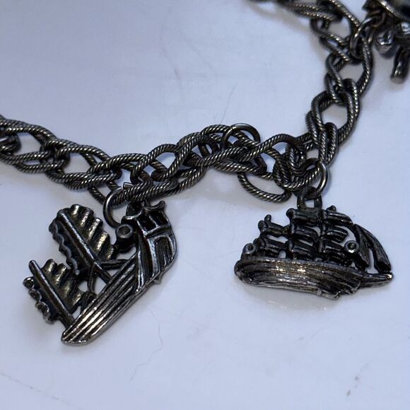 Vintage silver tone charm bracelet featuring modes of travel - Picture 3 of 8